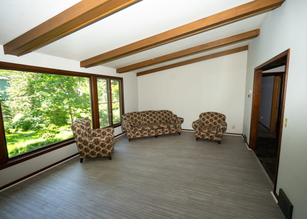 Living room with large windows and seating